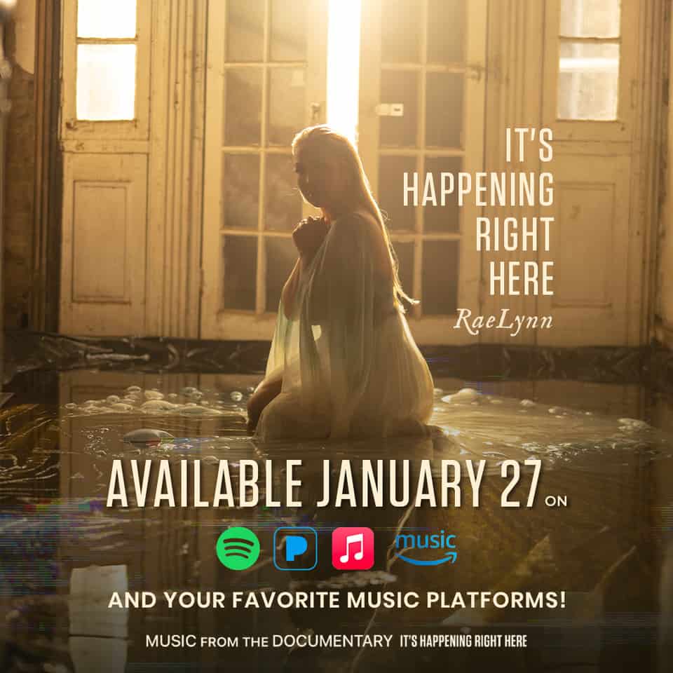 An advertisement for RaeLynn's song, "It's Happening Right Here" featuring a photograph of RaeLynn kneeling in a white gown.